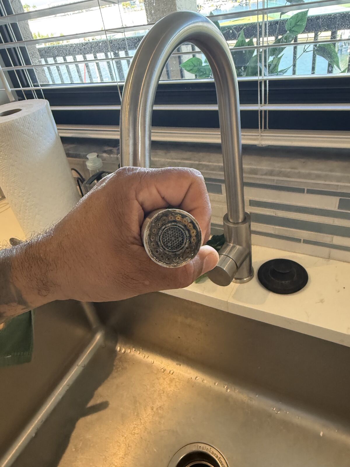 Calcium buildup removed from kitchen faucet
