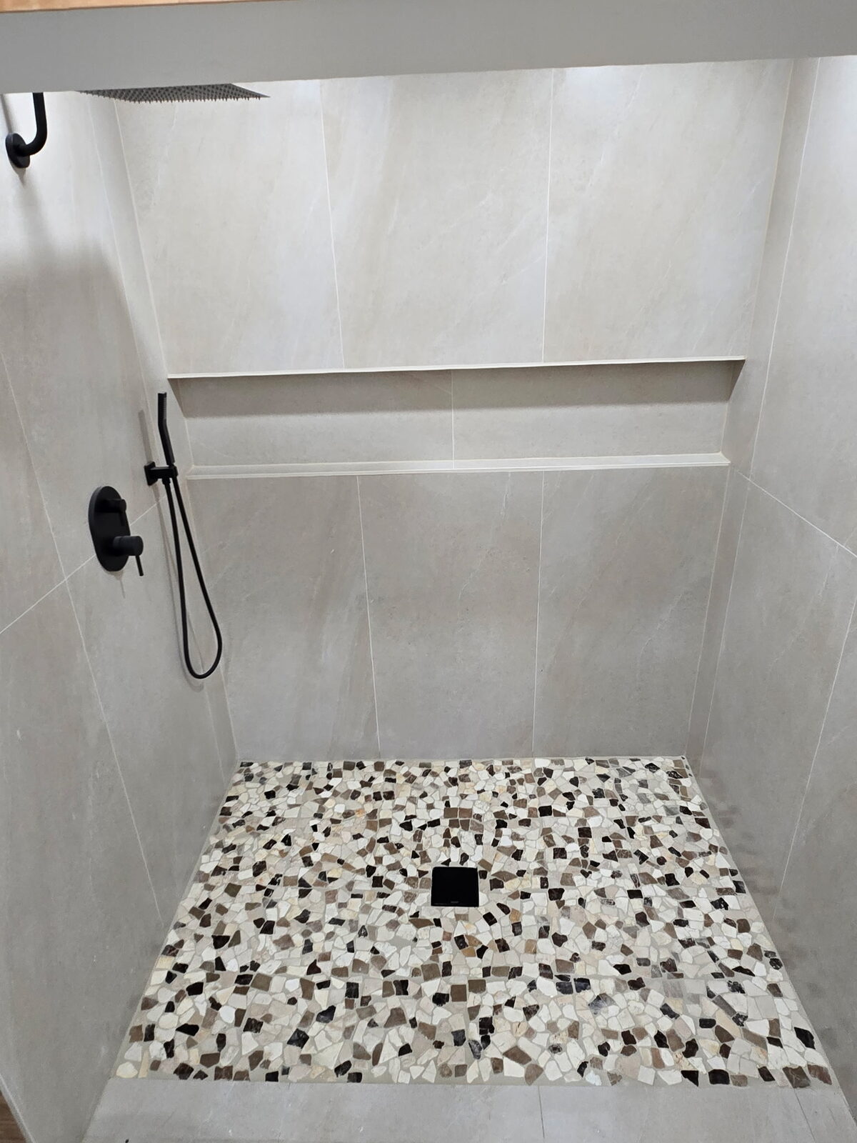 Close-up of pebble mosaic shower floor
