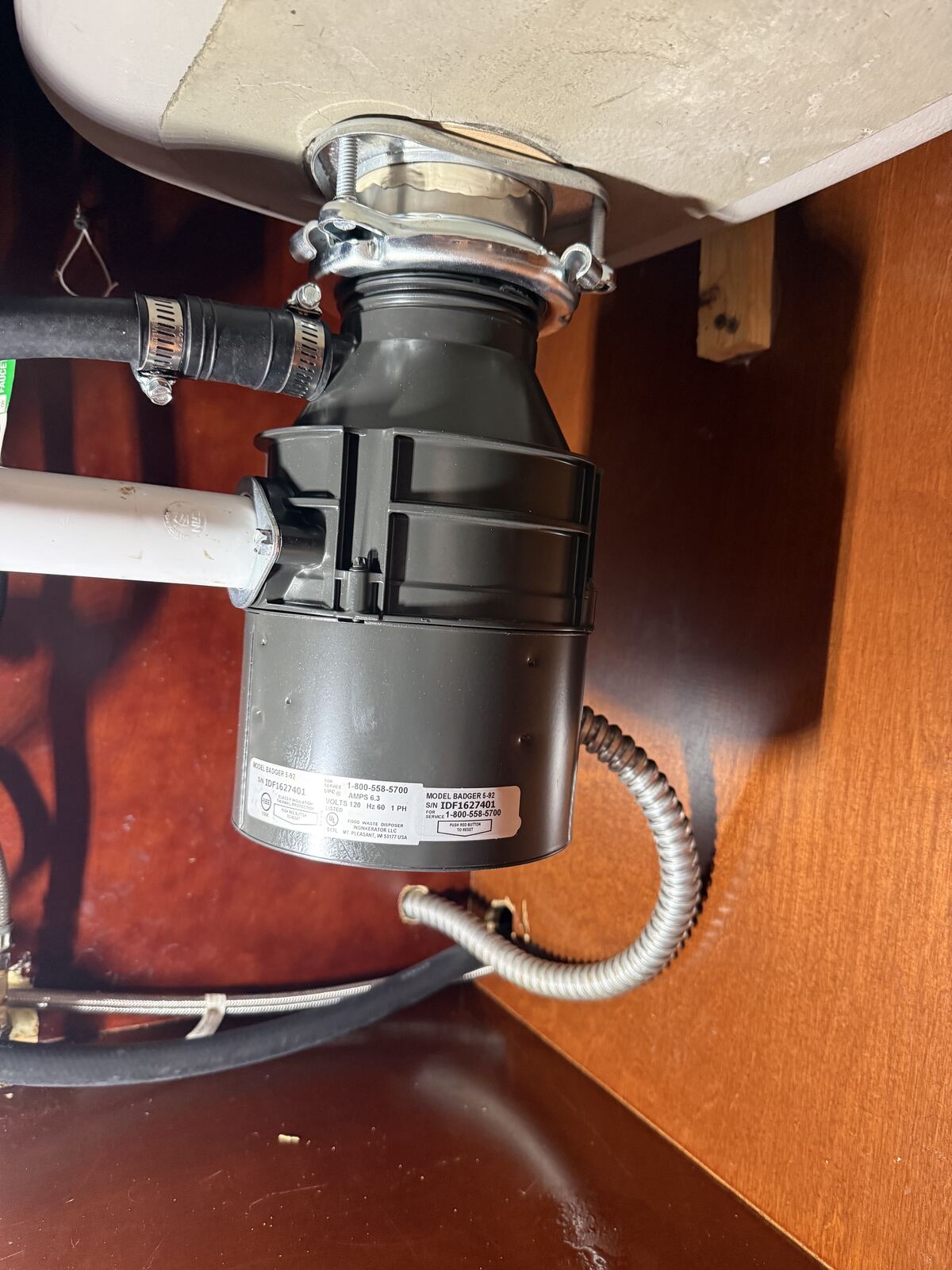 Garbage disposal installation under kitchen sink
