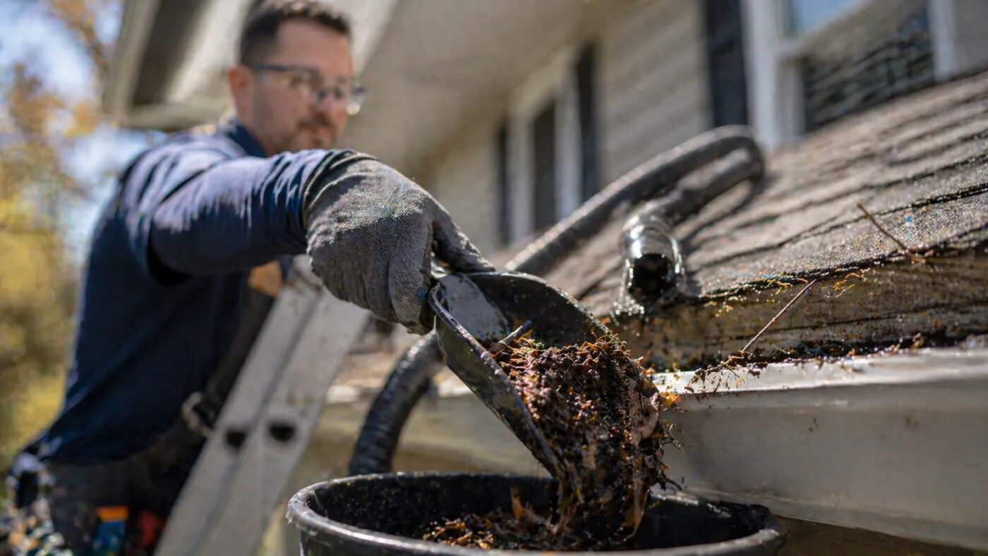 Gutter cleaning in progress